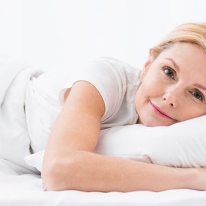 old aged lady lying on the orthopedic mattress